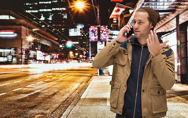 istock Man on mobile at night in the city 469036144
