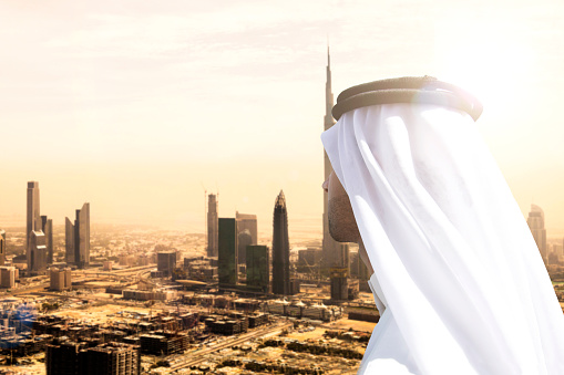 High view from a construction site of a sheikh looking at view of downtown Dubai in United Arab Emirates. Sunny day over the tall skyscrapers and office buildings on Sheikh Zayed Road.