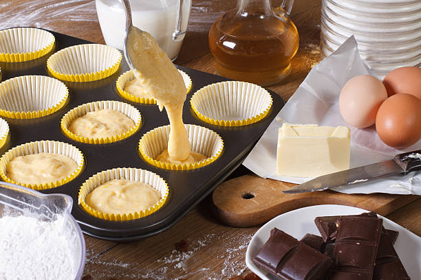 The process of preparing cupcakes in the kitchen