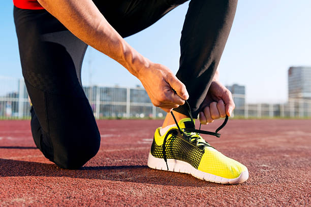 istock Young Man Tying his Laces 469037518