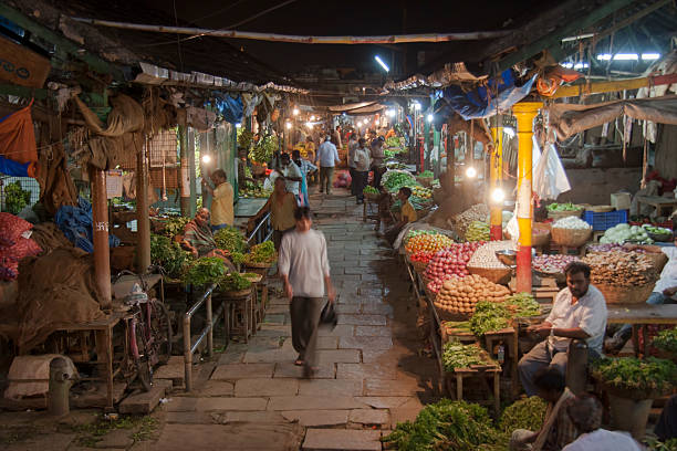 green grocery stalls on devaraja market at night in india