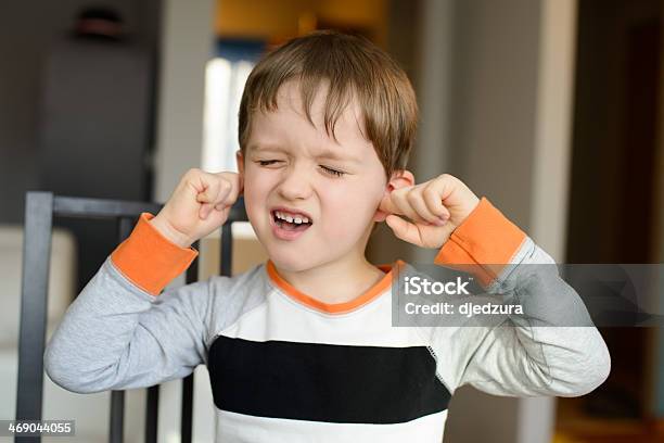4 Year Old Boy Clog His Ears With Fingers Stock Photo - Download Image Now - Ear, Pain, Child