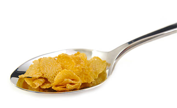 istock Bunch of corn flake cereals on a metal spoon 469044270