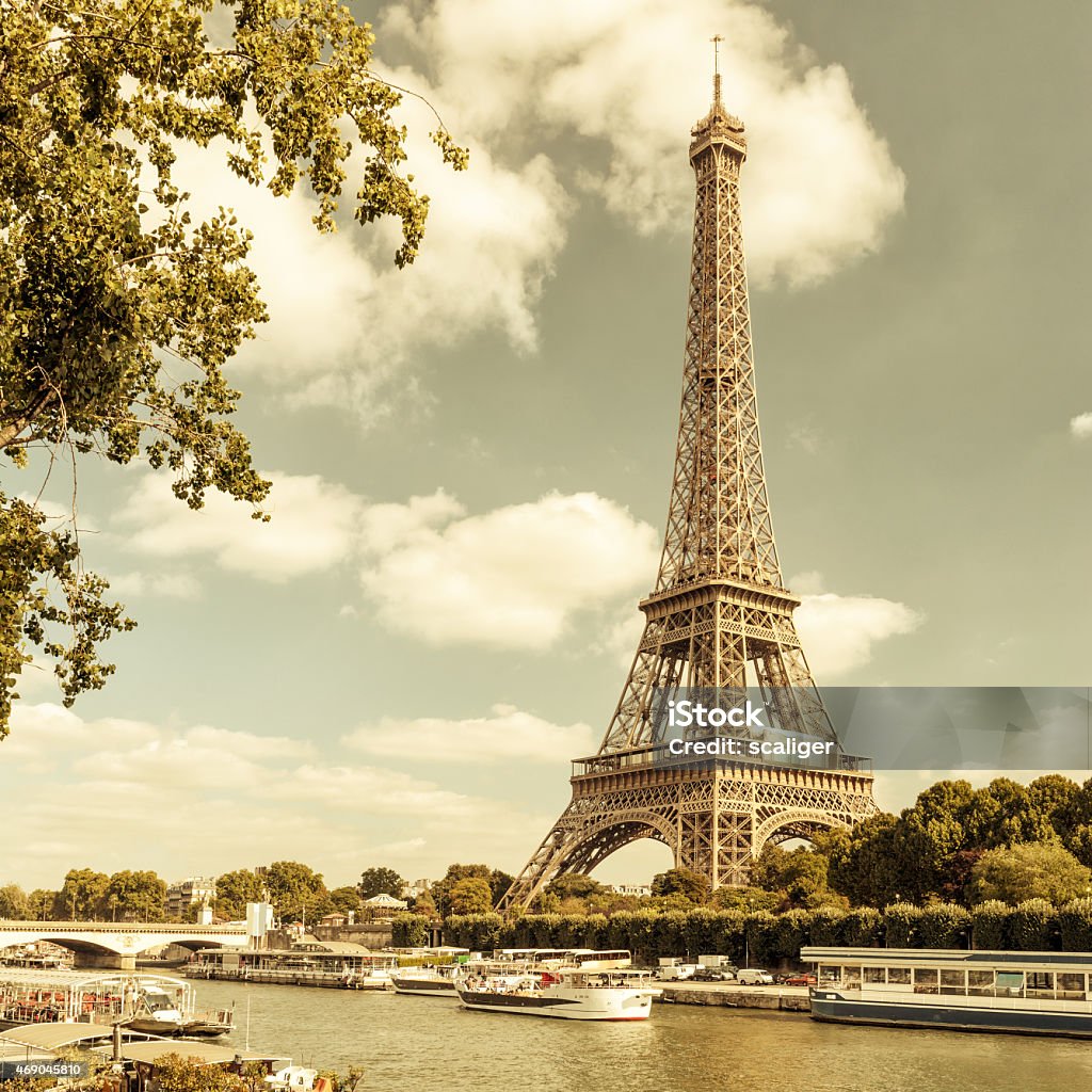 The Eiffel tower from the river Seine in Paris The Eiffel tower from the river Seine in Paris, France. Vintage photo. 2015 Stock Photo
