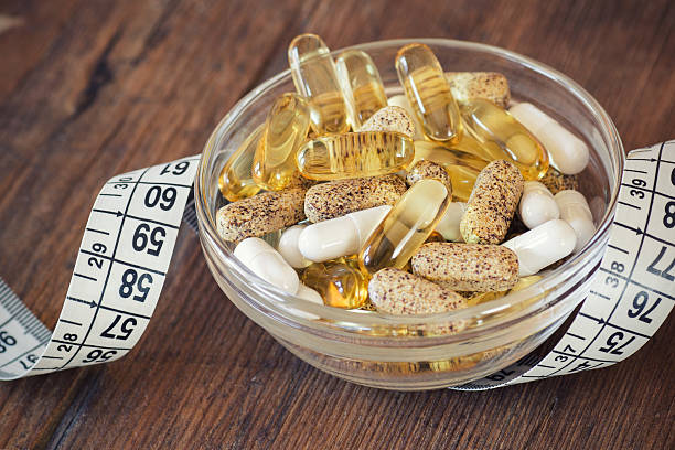 Nutritional supplements in capsules and tablets. stock photo