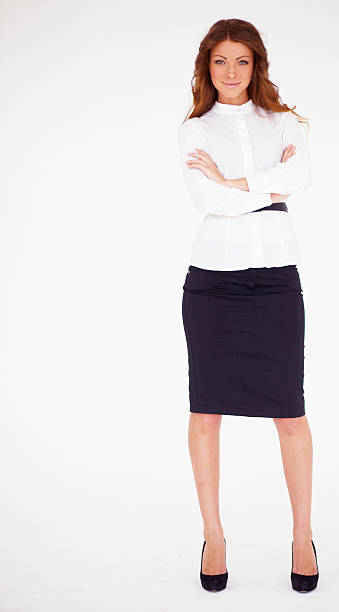 istock Confident young business lady standing with folded hand 469048353