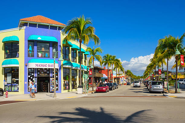Fort Myers Beach Shopping District, Florida Fort Myers, USA - December 3, 2013: Pedestrians walking past colorful businesses on Old San Carlos Boulevard, in the central shopping and dining district of Fort Myers Beach, Florida. fort myers photos stock pictures, royalty-free photos & images