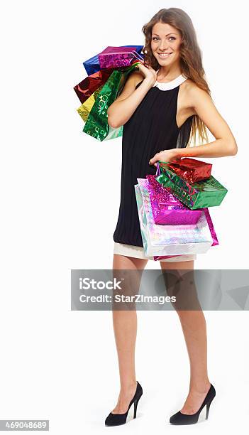 Smiling Young Woman Posing With Lots Of Shopping Bags Isolated Stock Photo - Download Image Now