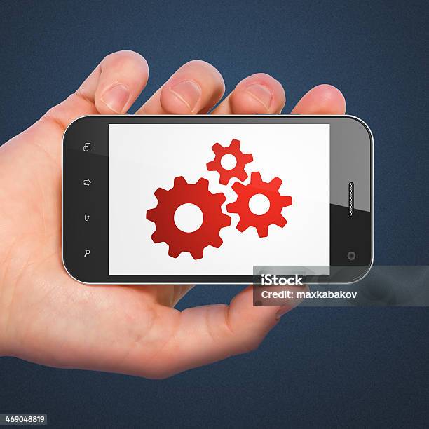 Foto de Conceito De Desenvolvimento Web Gears Em Smartphone e mais fotos de stock de Codificação