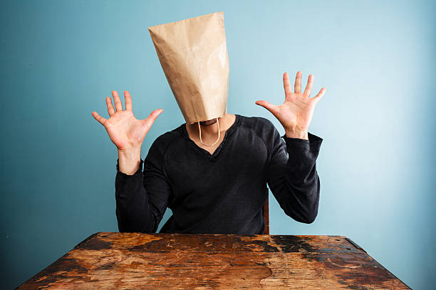 istock shocked man with bag over head 469049517
