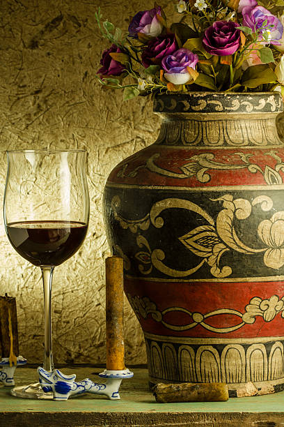 istock red wine and glass on a old paper background 469051119
