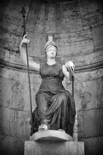 Paganism in Ancient Times. Neoclassical marble statue of goddess, erected in the 19th century in Rome historic center
