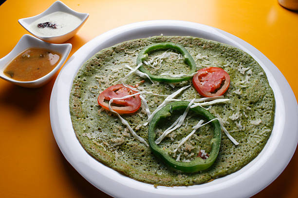 Palak Dosa - A Crispy  Spinach pancake stock photo