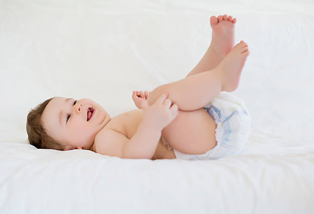istock Happy child playing on bed 469056724
