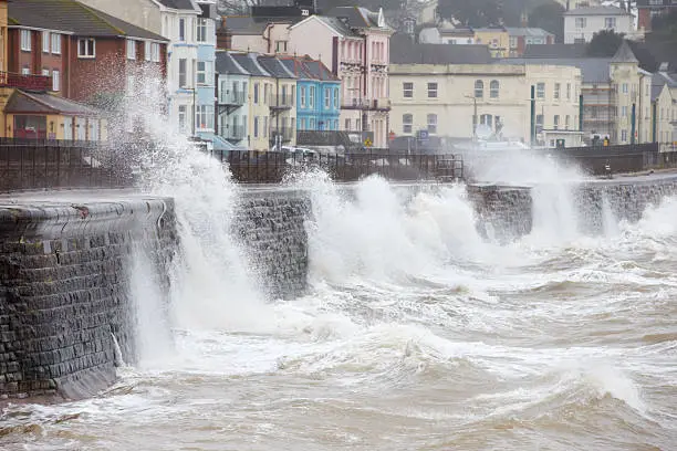 Photo of Large waves breaking against the sea wall at Dawlish, Devon