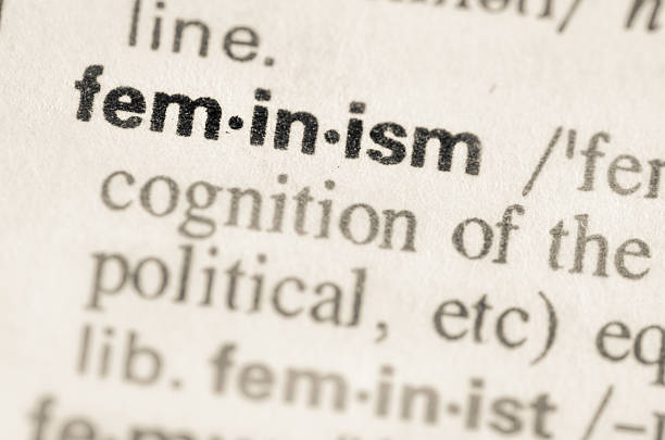 słownik definicja słowa feminism - grammar text dictionary single word zdjęcia i obrazy z banku zdjęć