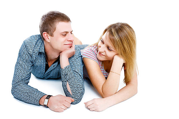 smiling girl and boy looking at each other stock photo