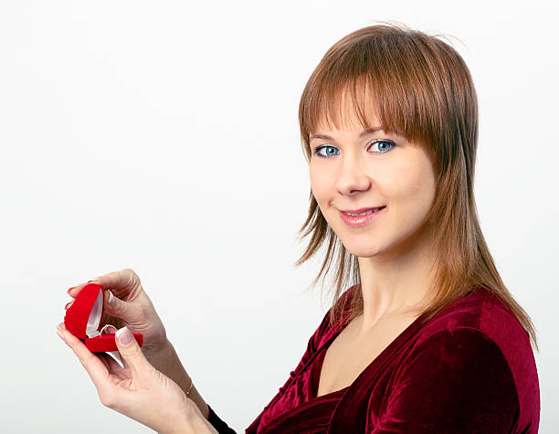 young woman opens the ring box stock photo