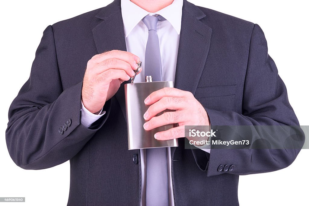 Man with his hip flask Man with his hip flask, isolated on white background. 2015 Stock Photo