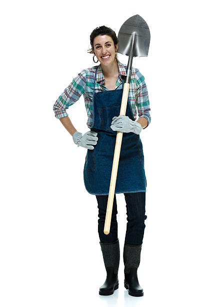 istock Cheerful female gardener holding shovel 469063978