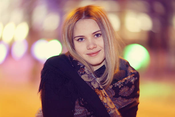 istock young woman winter city lights 469067314