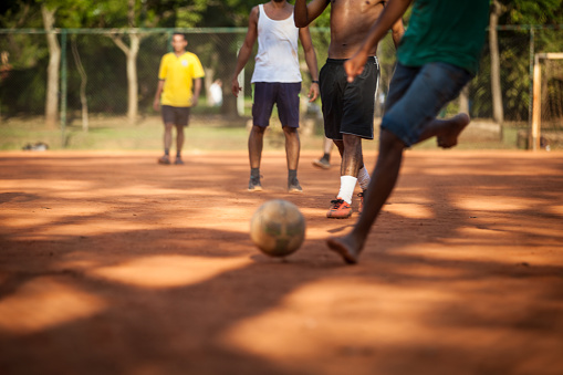 Focus on the stuff which give name to the game: foot-ball. Brazilian amateur players doing it with bare feet.
