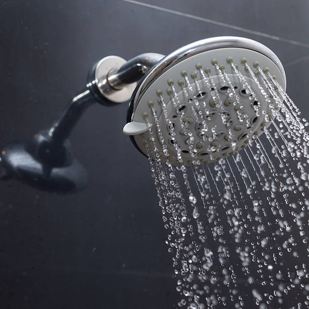 istock shower head with water drops flowing 469069330