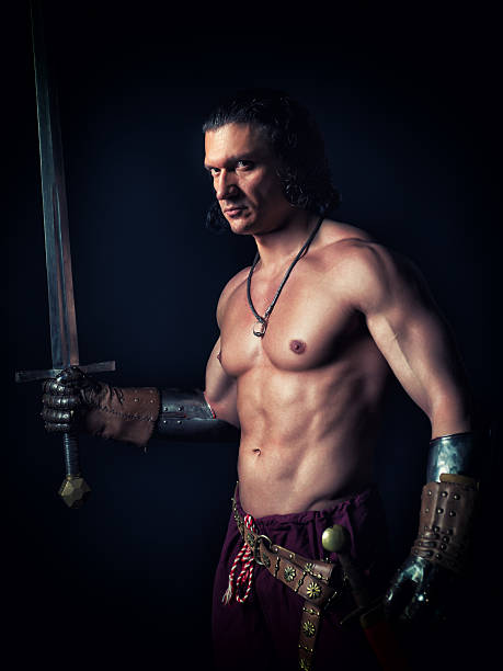 istock half-naked man with a sword in medieval clothes 469076212