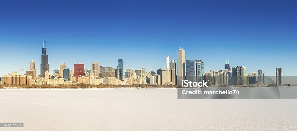 Chicago downtown panorama in winter scenery Chicago downtown panorama in winter scenery with frozen snow Lake Michigan Apartment Stock Photo