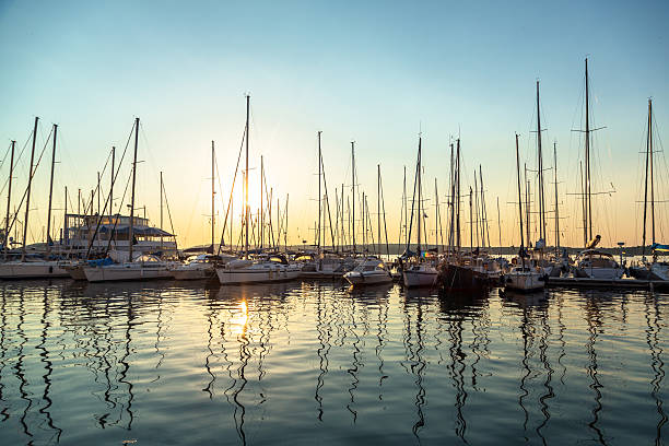 Port in the sunset Port in the sunset without people at sunset sailboat mast stock pictures, royalty-free photos & images