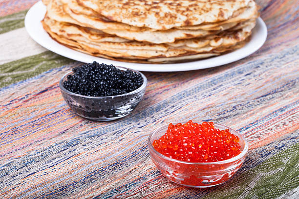 istock Russian pancakes - blini with red and black caviar 469078002