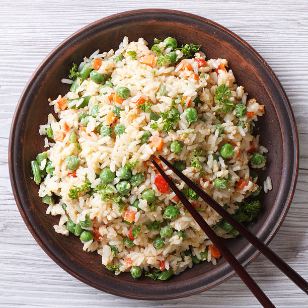 istock Fried rice with egg and vegetables closeup. top view 469078730