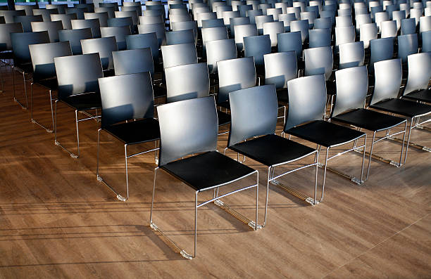 istock Rows of empty chairs prepared for an indoor event 469081340