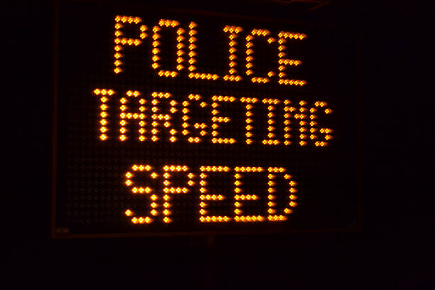 istock Police targeting speeding drivers sign at night 469081876