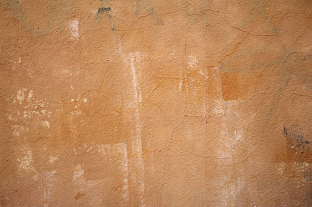istock Texture of old wall covered with yellow stucco 469082230