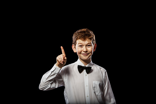 Happy teenage boy showing thumb up