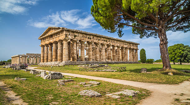 Temples of Paestum Archaeological Site, Campania, Italy Temple of Hera at famous Paestum Archaeological UNESCO World Heritage Site, which contains some of the most well-preserved ancient Greek temples in the world, Province of Salerno, Campania, Italy. goddess of ocean stock pictures, royalty-free photos & images