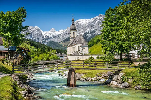 Scenic mountain landscape in the Bavarian Alps with famous Parish Church of St. Sebastian in the village of Ramsau, Nationalpark Berchtesgadener Land, Upper Bavaria, Germany.