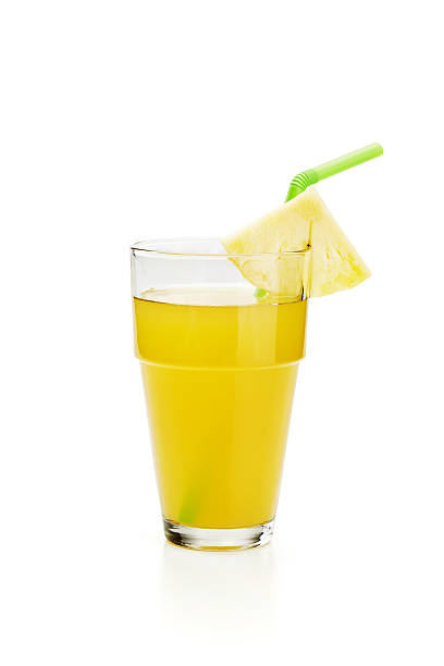 istock pineapple juice in glass on white 469084026