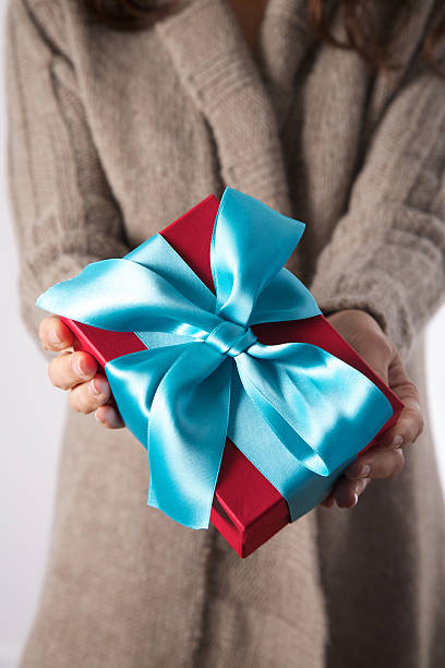 istock winter woman red gift 469084438