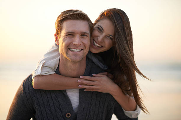 istock Piggyback ride on the beach 469088137
