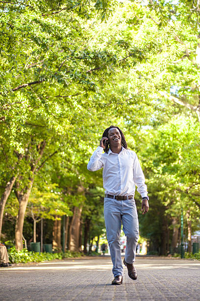 istock African businessman taking a walk talking on the phone 469088159