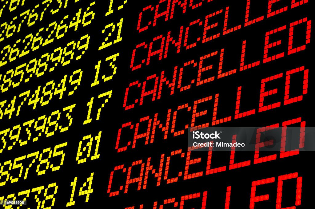 Cancelled flights on airport board Cancelled flights on airport board panel Cancellation Stock Photo