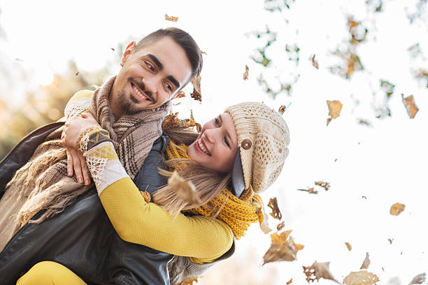 istock Happy couple piggybacking outdoors during autumn. 469089828