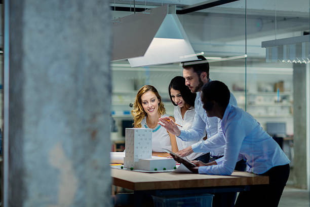 istock Multiethnic Team of architects expertise architectural model in the office. 469089864