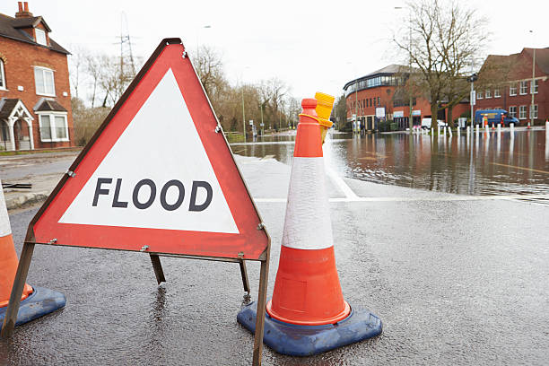 istock Warning Traffic Sign On Flooded Road 469091864
