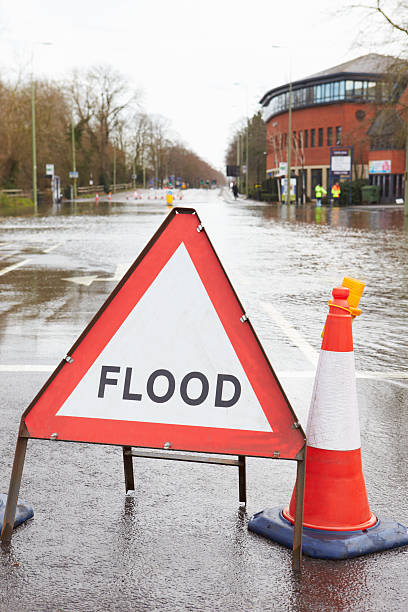 istock Warning Traffic Sign On Flooded Road 469095700