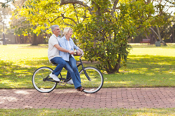 istock mature couple enjoying bicycle ride 469095819
