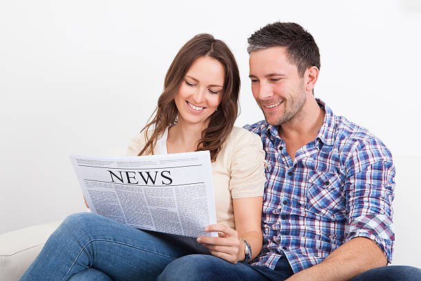 istock Couple Reading Newspaper 469096271