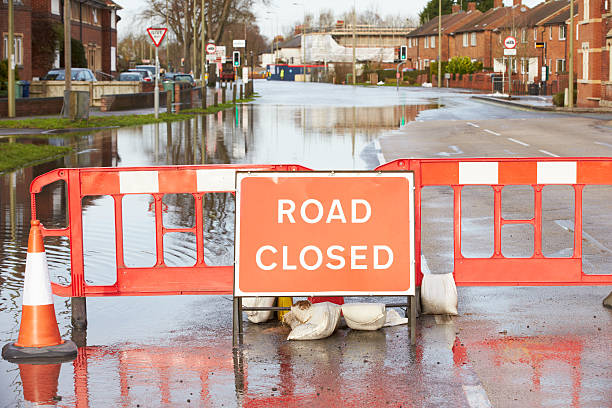 istock Warning Traffic Sign On Flooded Road 469097008
